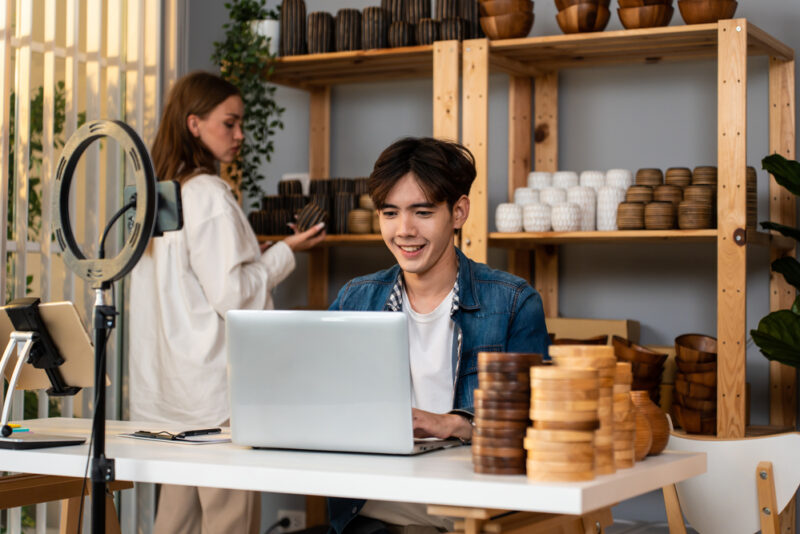 An individual researching how to invest in small businesses online 