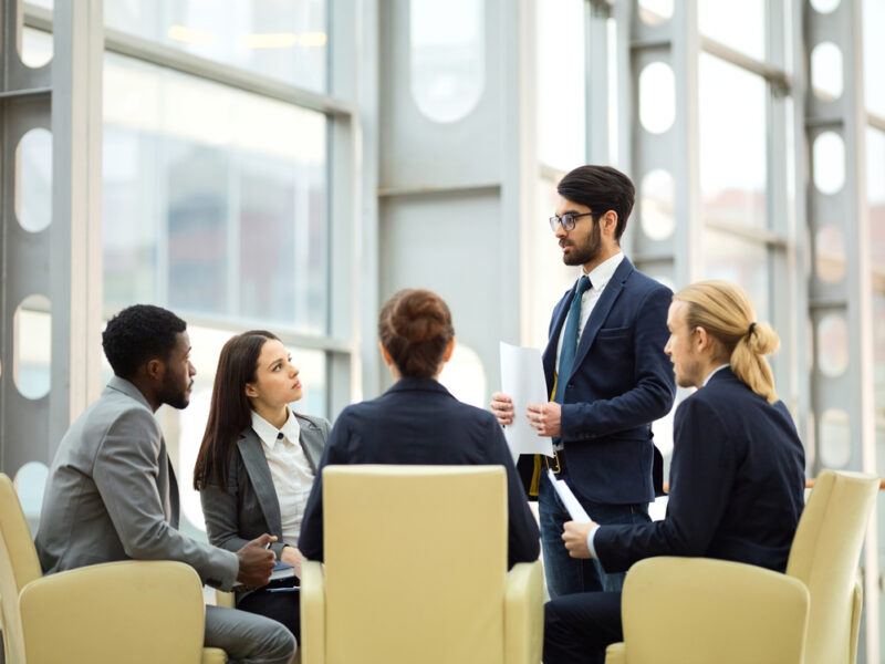 A group of investors having a meeting to discuss alternative assets.
