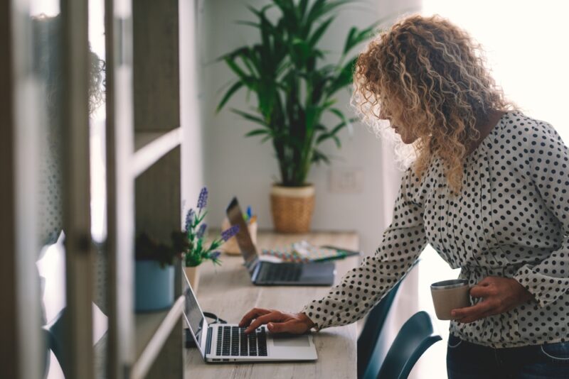 A lady glancing at the performance of the alternative assets she invested in.