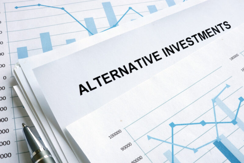 A stack of papers intended to explain what are alternative investments.