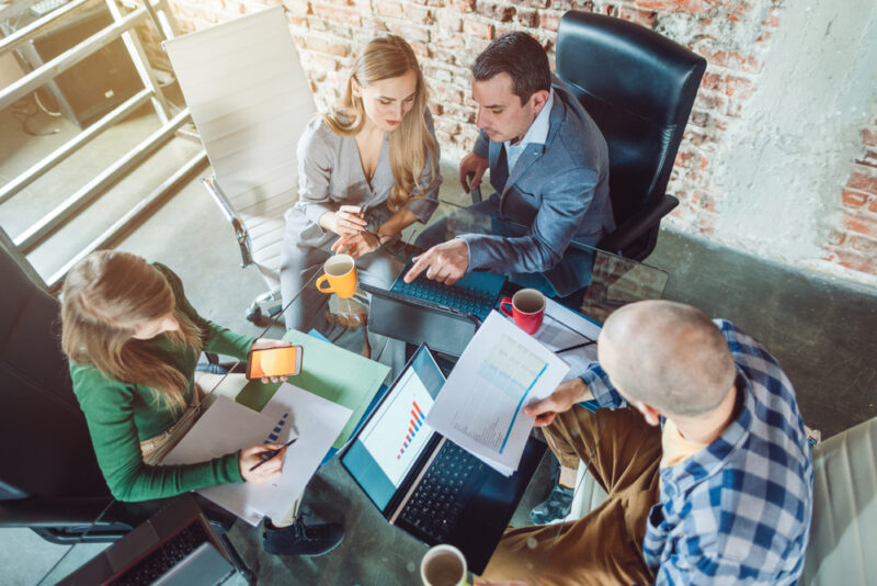 A team engaged in due diligence before they buy SaaS businesses. 