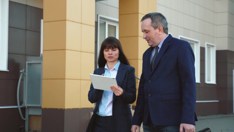 Two investors looking at some stats to help them answer the question, Are fractional ownerships a good investment?