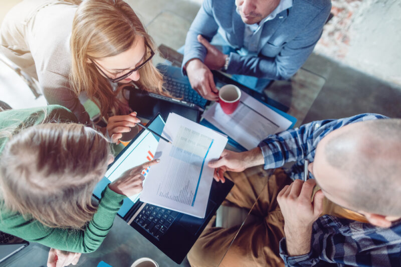 Investors in a meeting performing due diligence on a company