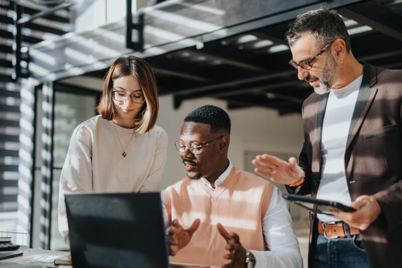 Workers strategizing How To Increase Customer Lifetime Value for SaaS