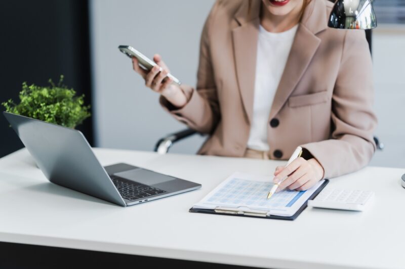 Woman looking over her investment strategy