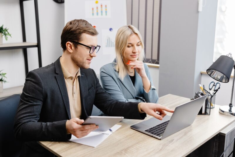 Man and woman discussing the best way to invest 200K