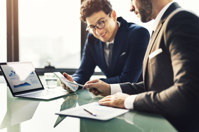 colleagues discussing the SaaS business model