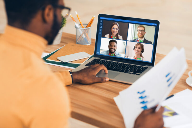 Man explaining to coworkers what are examples of digital assets
