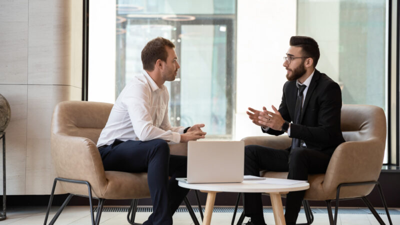Two men discussing SaaS investing