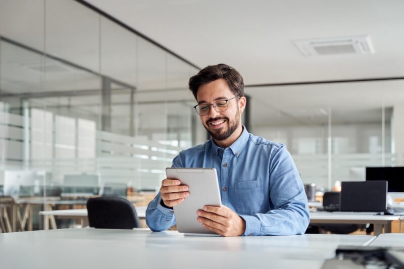 Man checking a list of alternative investments on his tablet