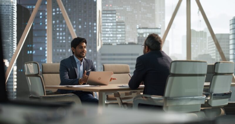 Man explaining how to invest in a business to a client